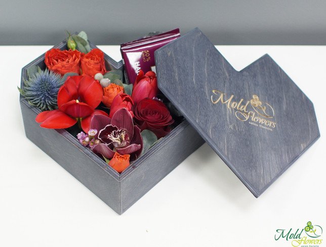 Wooden heart-shaped box with flowers photo