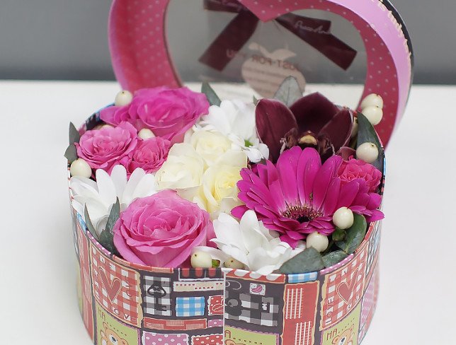 Black apple shaped box with white roses, chrysanthemum, pink gerbera, orchid, rose and eucalyptus photo