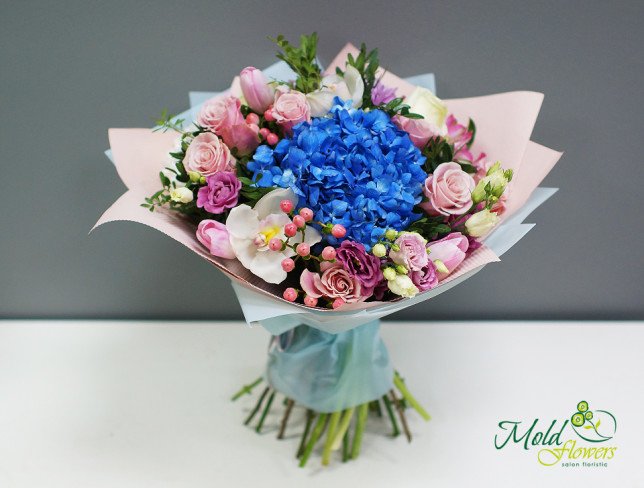 Bouquet with blue hydrangea, green roses, eustoma, pink tulips, gerberas, hypericum, eucalyptus photo