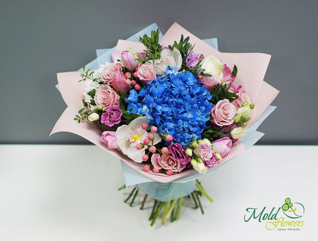 Bouquet with blue hydrangea, green roses, eustoma, pink tulips, gerberas, hypericum, eucalyptus photo