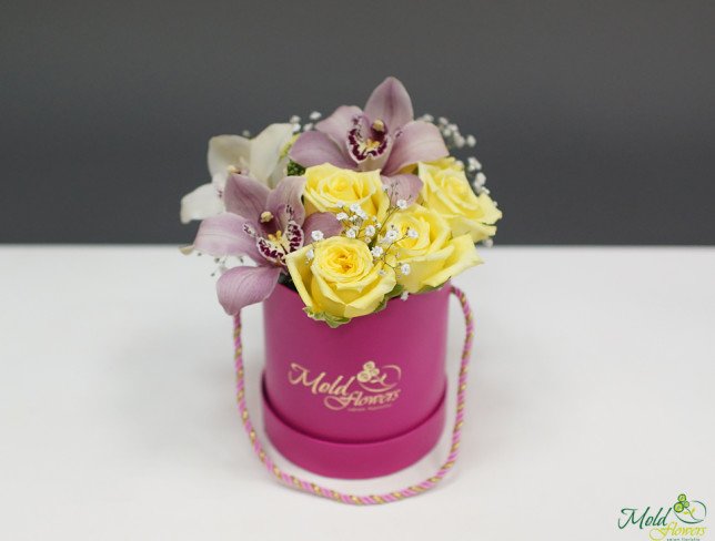 Small pink box with yellow roses, white and burgundy orchids photo