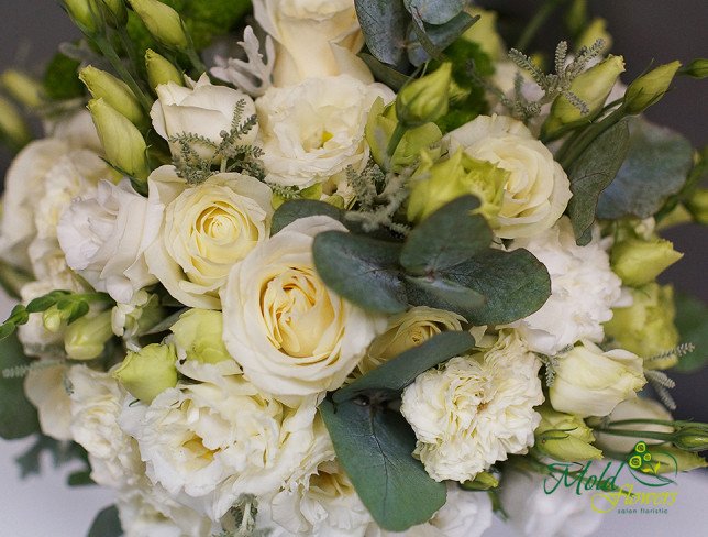 Bridal bouquet of white roses, lisianthus, carnations photo