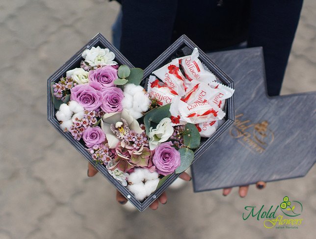 Composition of chrysanthemums, roses, cotton flowers, alstroemeria, eucalyptus, and wax flowers with a wooden heart filled with Raffaello from moldflowers.md