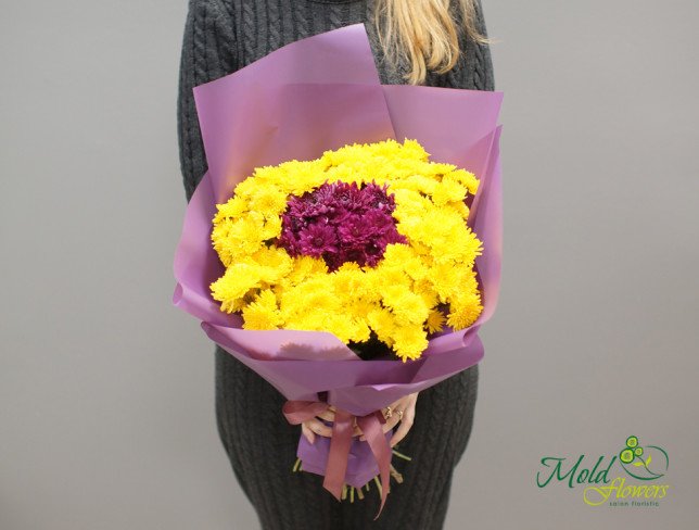 Bouquet with yellow and pink chrysanthemums, wrapped in purple paper