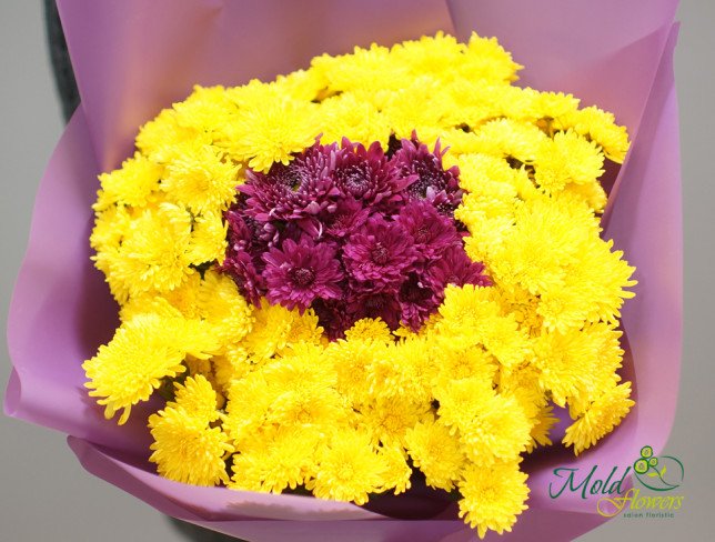 Bouquet with yellow and pink chrysanthemums, wrapped in purple paper