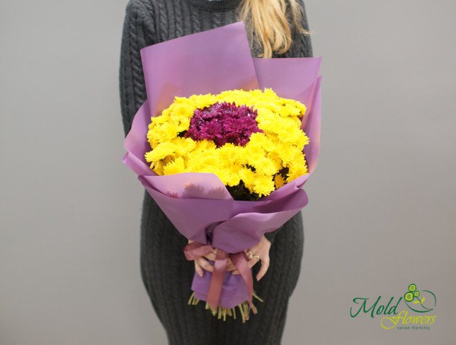 Bouquet with yellow and pink chrysanthemums, wrapped in purple paper