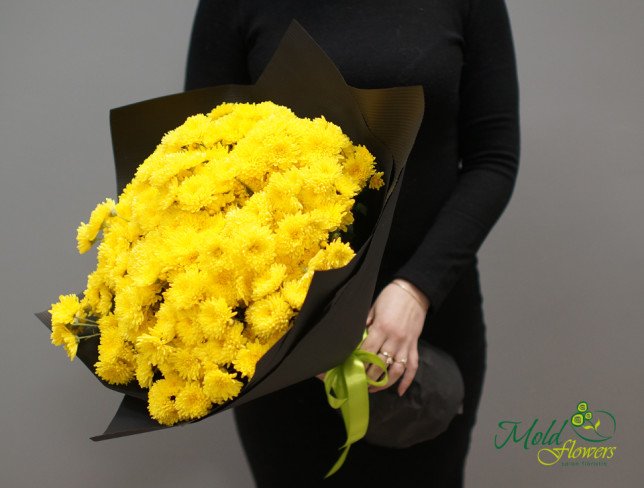 Yellow chrysanthemum bouquet in black paper