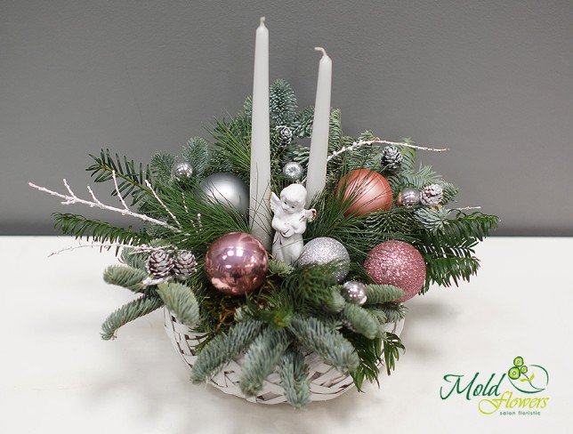 Composition with Christmas toys, white angel, candles, cones, spruce branches photo