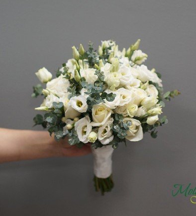 Bridal bouquet of white roses, eustoma, and eucalyptus photo 394x433