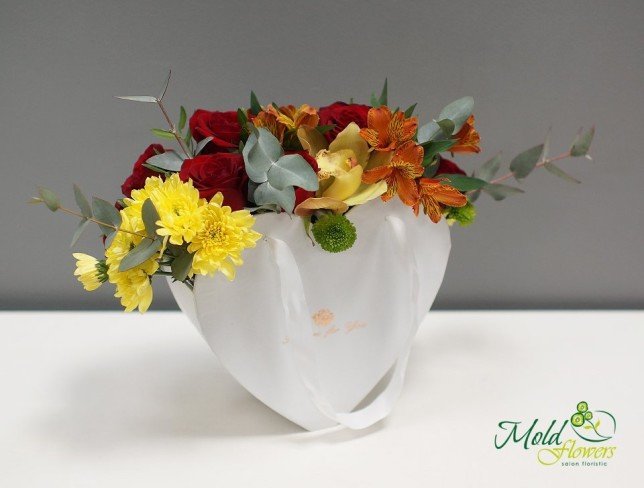 White heart box with red roses, yellow orchid, alstromeria, mimosa and eucalyptus photo