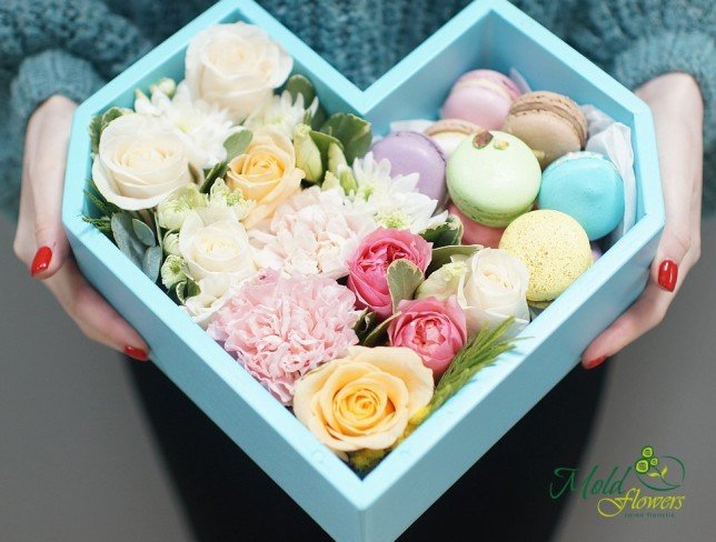 Composition of roses, carnations, chrysanthemums, eustoma, eucalyptus, and macarons from moldflowers.md