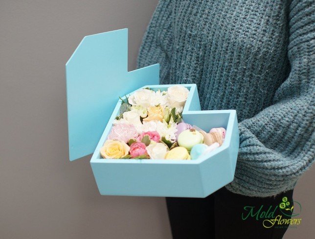 Composition of roses, carnations, chrysanthemums, eustoma, eucalyptus, and macarons from moldflowers.md