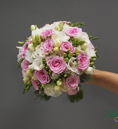 Bridal bouquet of pink roses, lisianthus, and white freesia photo 394x433