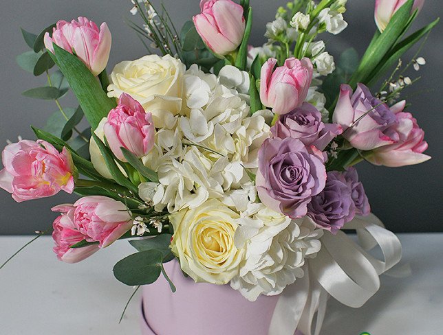 Box with white hydrangea and peony pink tulips photo