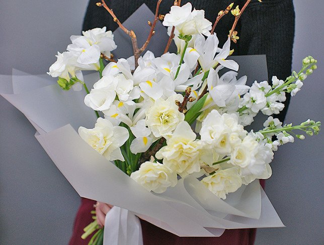 Bouquet with white irises, daffodils and prunus photo