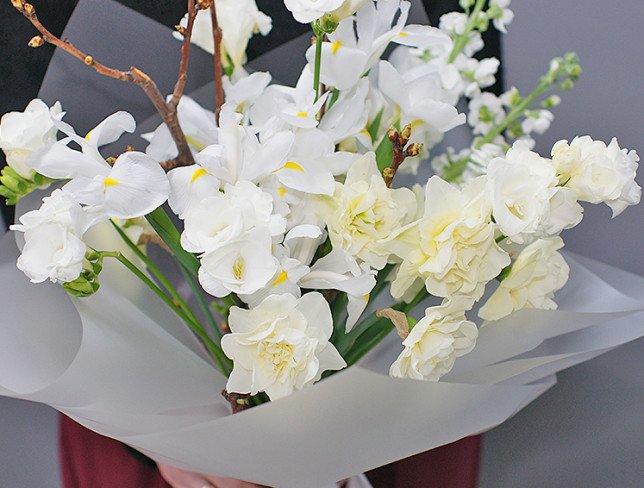 Bouquet with white irises, daffodils and prunus photo