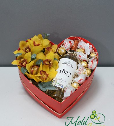 Heart box with yellow orchids, chocolates and white wine photo 394x433