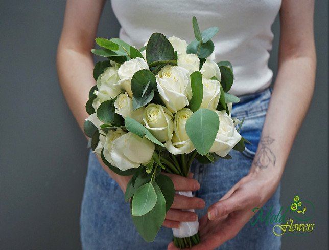 Bridal bouquet of white roses and eucalyptus photo