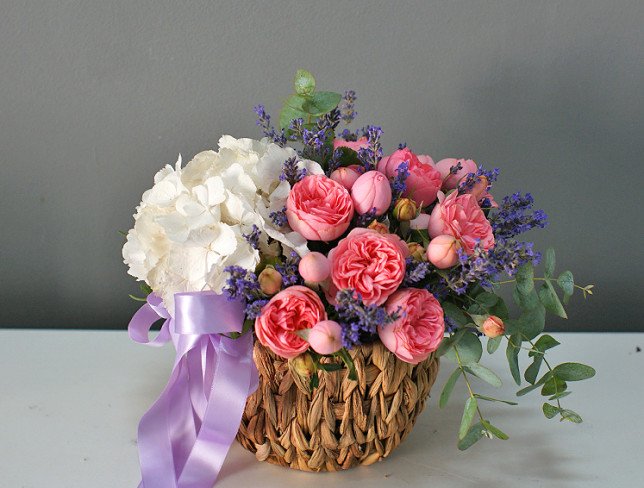 Basket with white hydrangea and peony roses photo