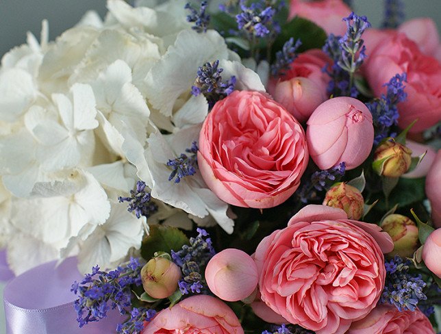 Basket with white hydrangea and peony roses photo