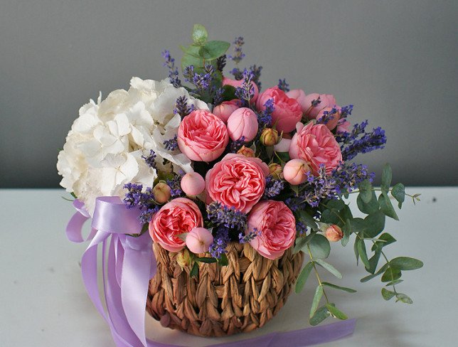 Basket with white hydrangea and peony roses photo