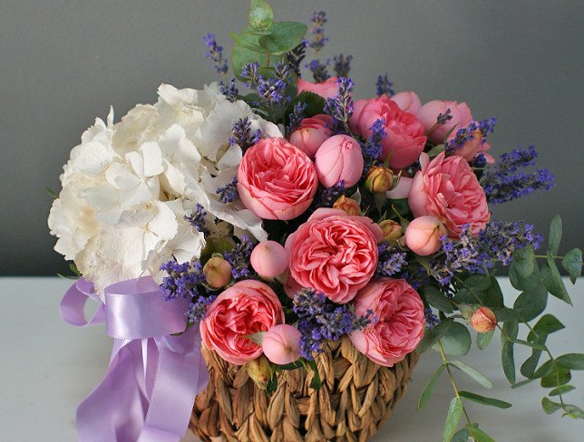 Basket with white hydrangea and peony roses photo