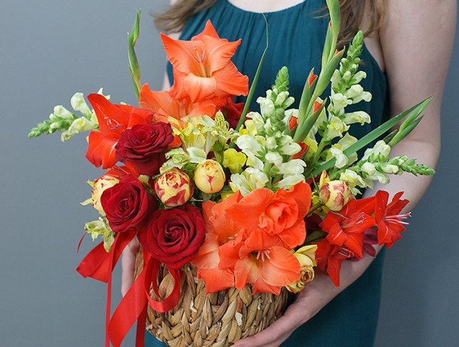 Basket with gladioli photo