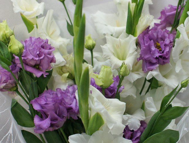 Bouquet of white gladioli and eustoma photo