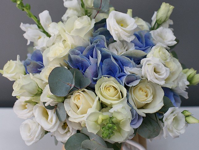 Bridal bouquet of white rose, hydrangea and eustoma photo