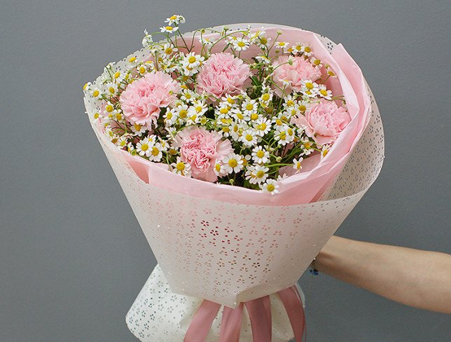 Bouquet of pink carnations and chamomile photo