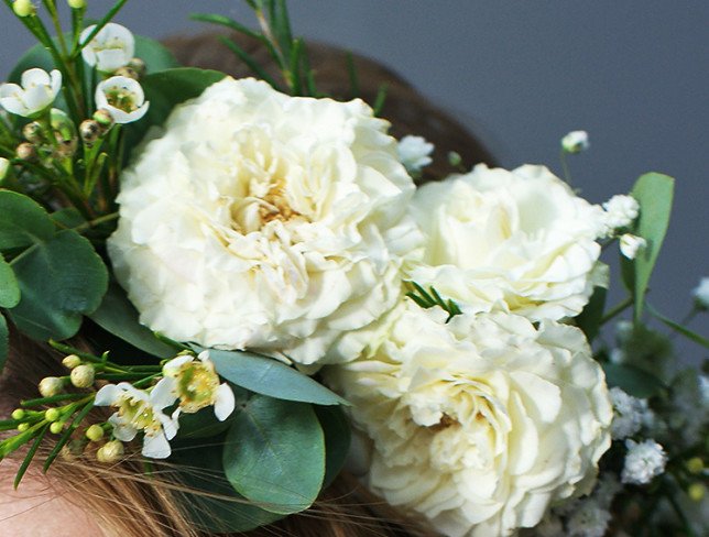 Wreath of white spray roses and gypsophila photo