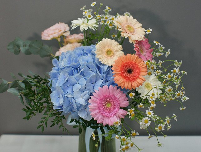 Vase + Bouquet with blue hydrangea and gerberas photo