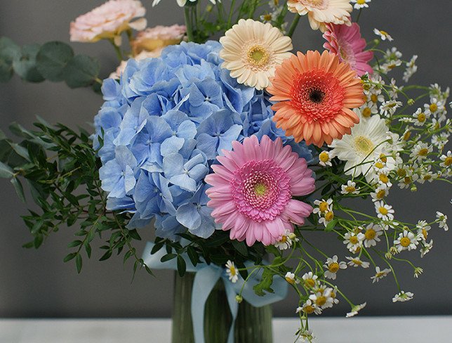 Vase + Bouquet with blue hydrangea and gerberas photo