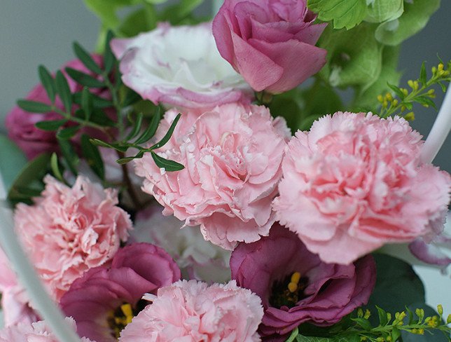 Handbag with pink carnations and eustomas photo