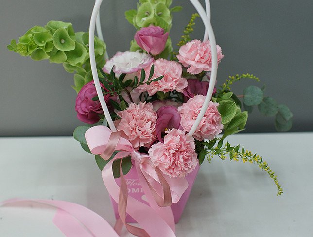 Handbag with pink carnations and eustomas photo