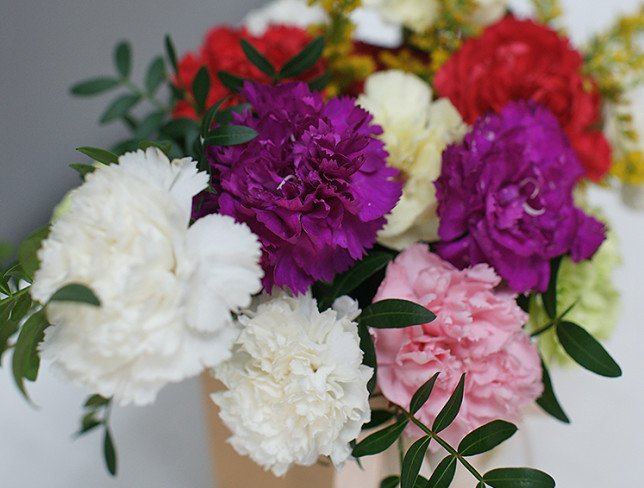 Handbag with multi-colored carnations photo