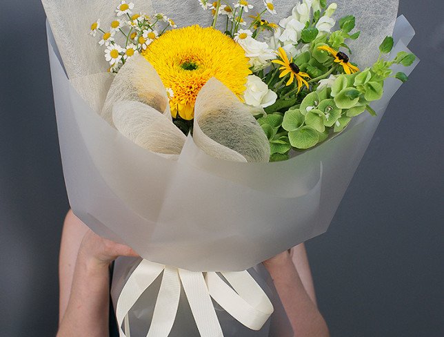 Bouquet of white roses, sunflowers and chamomile photo