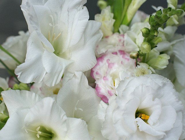 Box with white gladioli and eustoma photo