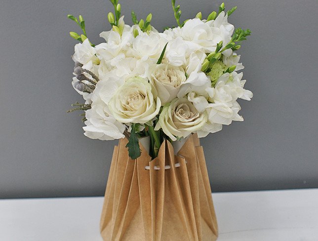 Bridal bouquet of green roses, hydrangea, freesia and carnations photo