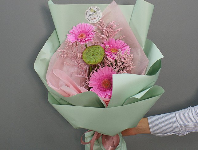 Bouquet of pink gerberas and lotus photo