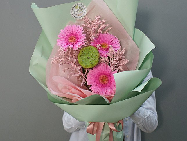 Bouquet of pink gerberas and lotus photo