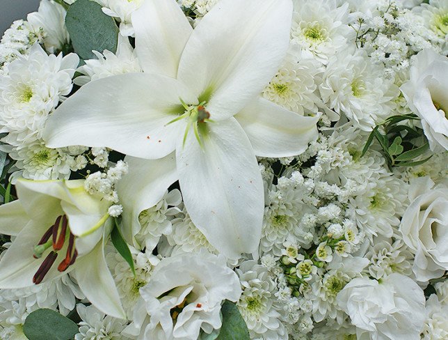 Heart of white chrysanthemums and lilies on a stand photo