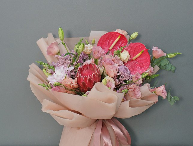 Bouquet of pink eustoma, anthurium and protea "Charm of Exotic" photo