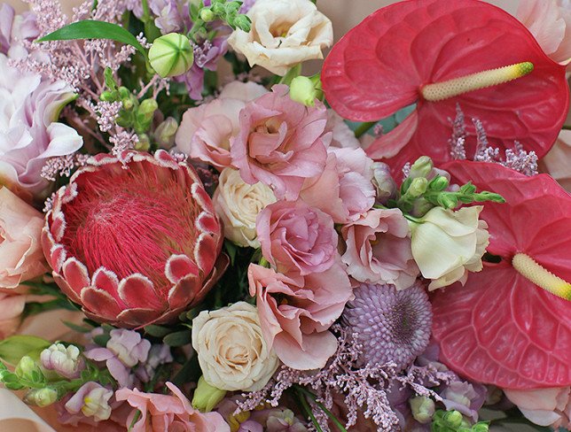 Bouquet of pink eustoma, anthurium and protea "Charm of Exotic" photo