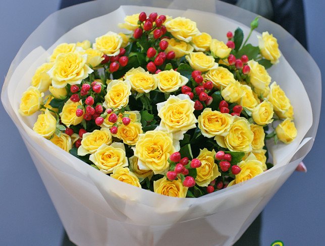 Bouquet of yellow bush roses and hypericum "Heart of the Sun" photo