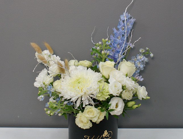 Box with white chrysanthemum and blue delphinium photo