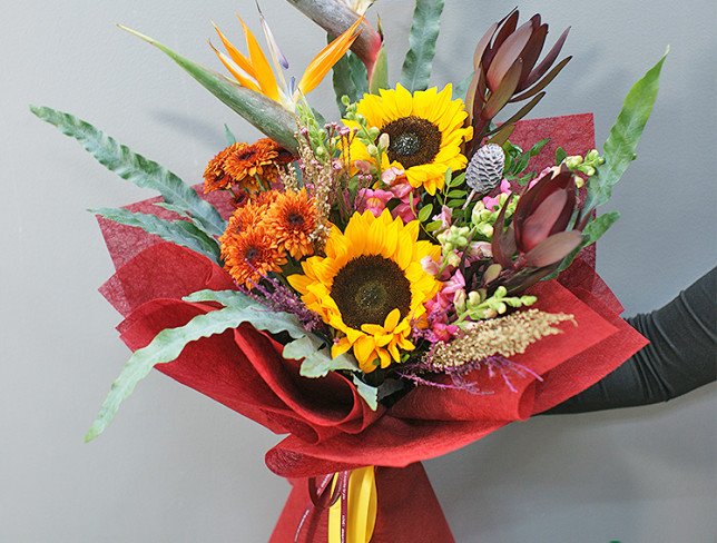 Bouquet of sunflowers and strelitzia "Sunny Tropic" photo