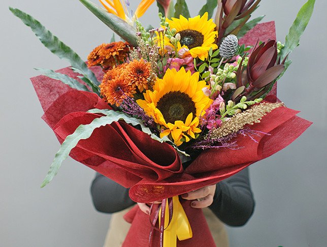 Bouquet of sunflowers and strelitzia "Sunny Tropic" photo