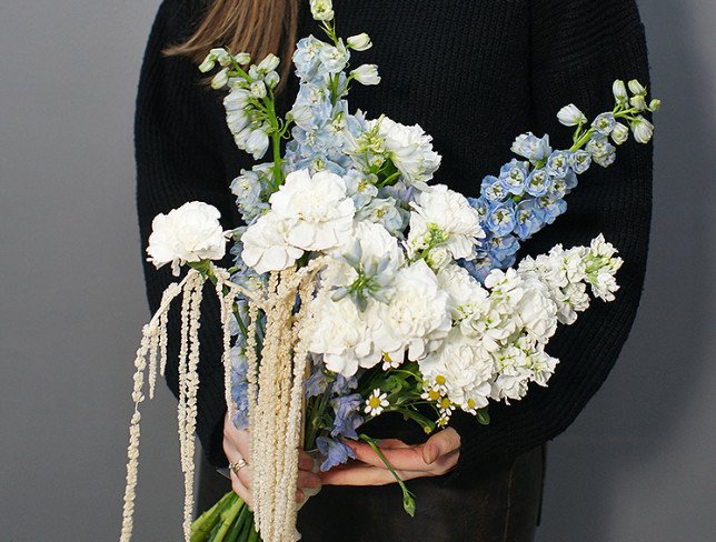 Bouquet of white carnations and blue delphinium photo