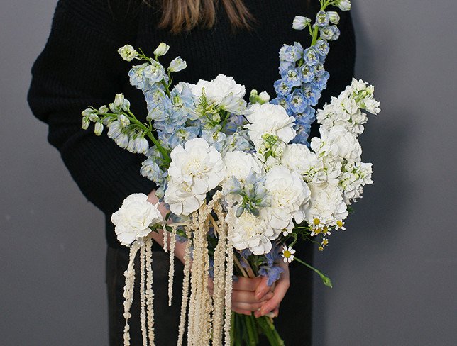 Bouquet of white carnations and blue delphinium photo